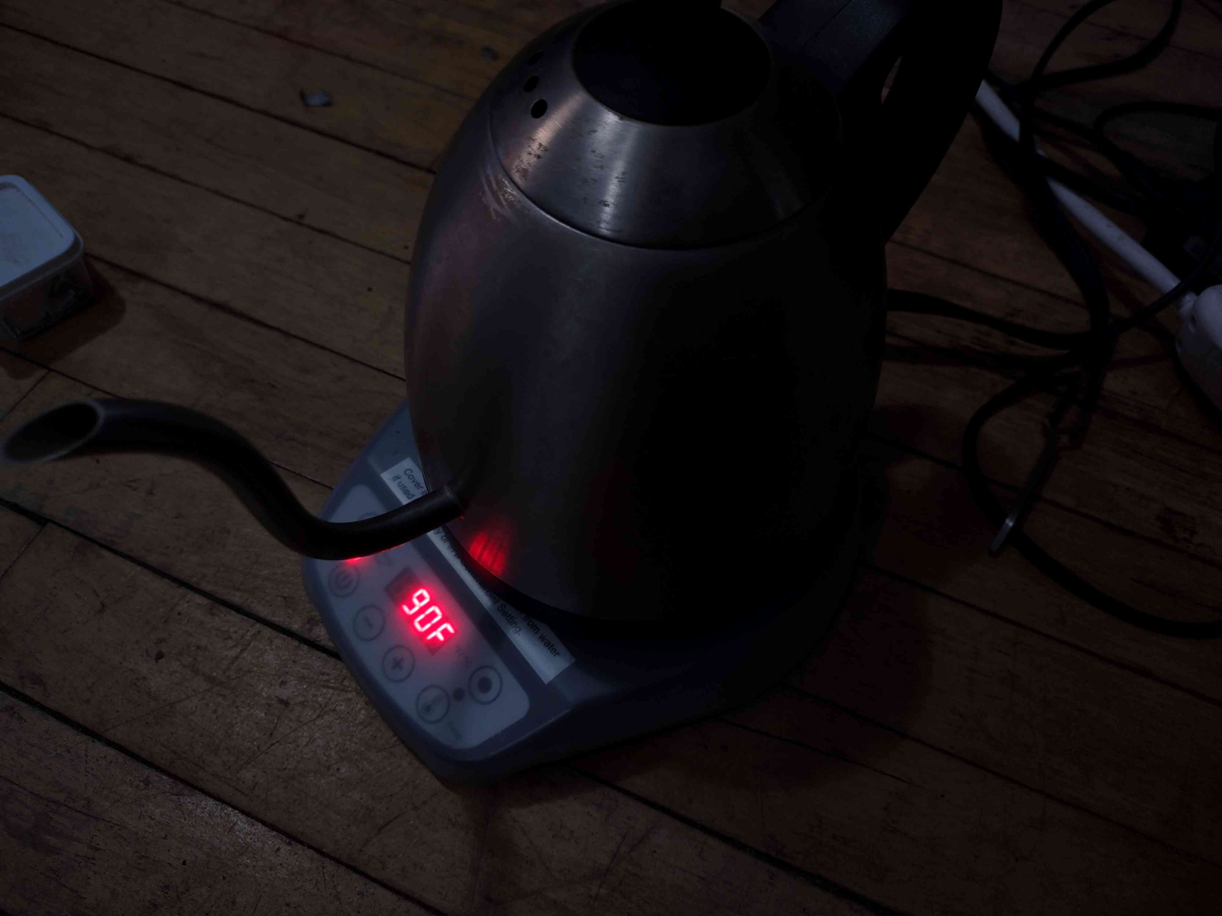 dark exposure photo of the kettle highlighting its bright red LCD display which reads: 90F