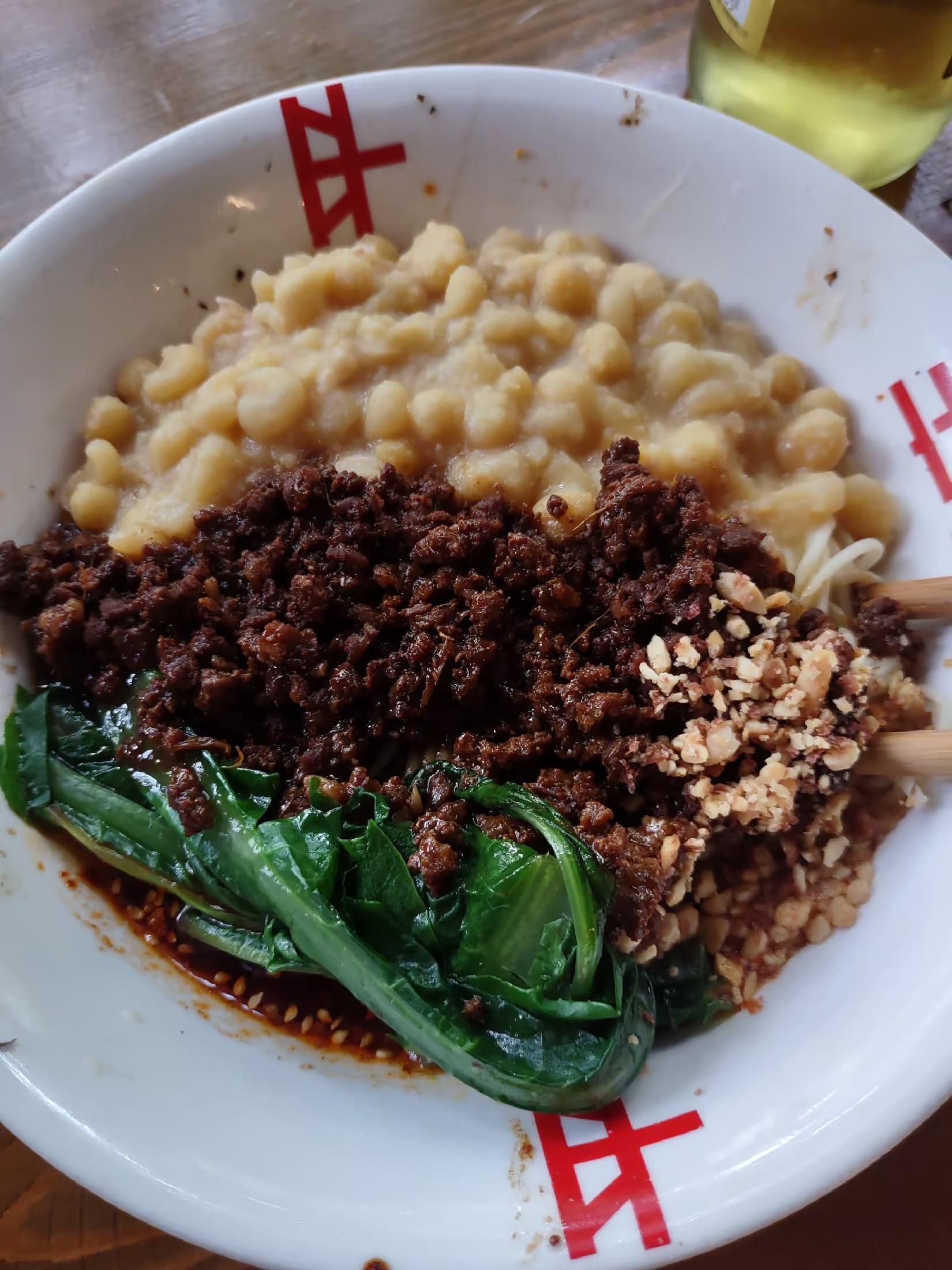 Chongqing noodles Xiao Mian (noodles served with tons of hot peppers, numbing spice, white beans, and wilted greens) 